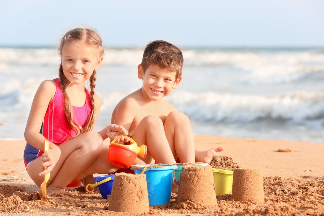 Children Making Sand Castles on the Beach