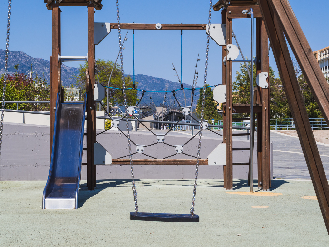 Playground with empty swing in San Pedro de Alcantara, Costa del Sol, Spain